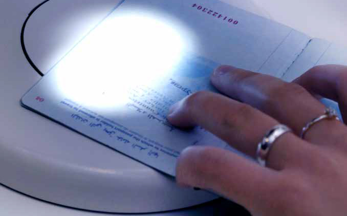 Illustration photo demonstrating the use of a passport reader